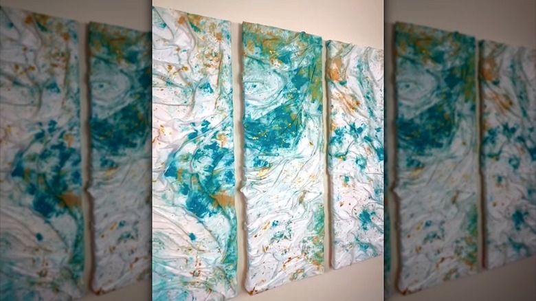 Three DIY wall art pieces made from old bed sheet