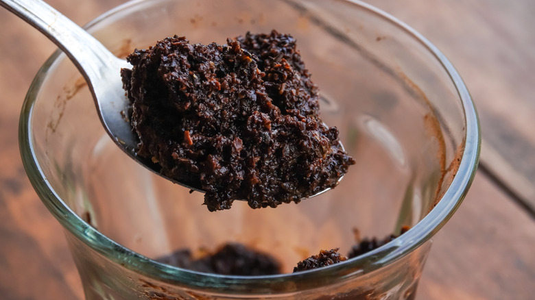 Wet coffee grounds in a cup