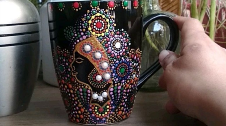 Mandala art on a black coffee mug