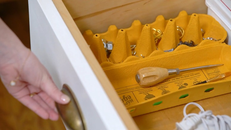 Using a yellow egg carton to organize drawer