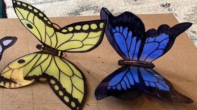Colorful butterfly decor cut out of gallon size milk jugs