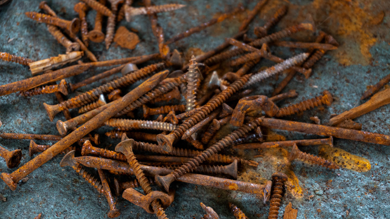 A pile of rusty nails and screws