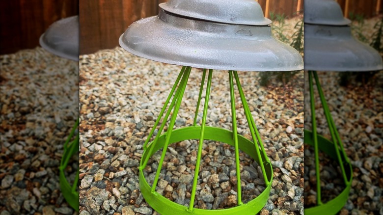 Metal lids used to create a garden art piece.