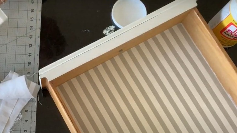 clothe scraps beside drawer with fabric drawer liner