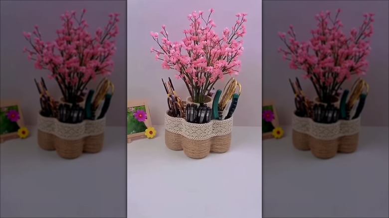rustic multi-holder organizer holding scissors, brushes, flowers, and other tools