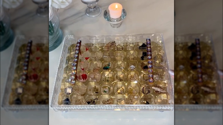 plastic chocolate box holding jewelry pieces