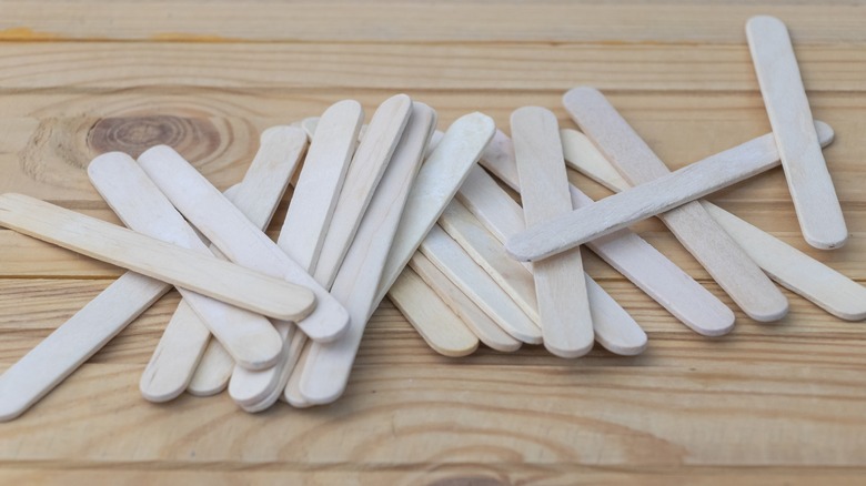 Popsicle sticks on a wooden table