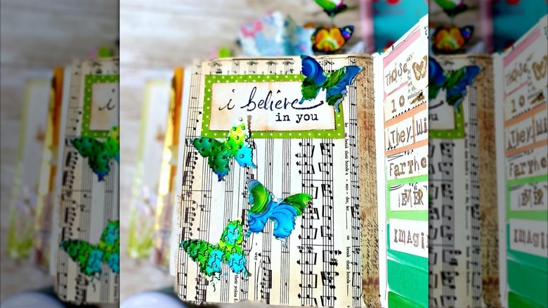 metal butterfly accents in scrapbook
