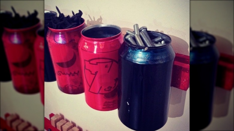 Magnetic bar with cans filled with hardware