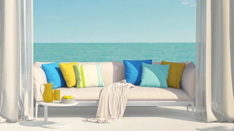 Bright cushions adding a splash of color to an outdoor daybed