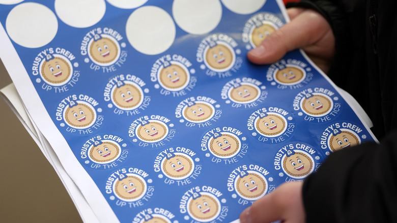 A sheet of stickers from Crusty's Crew is half used, leaving multiple blank spaces.