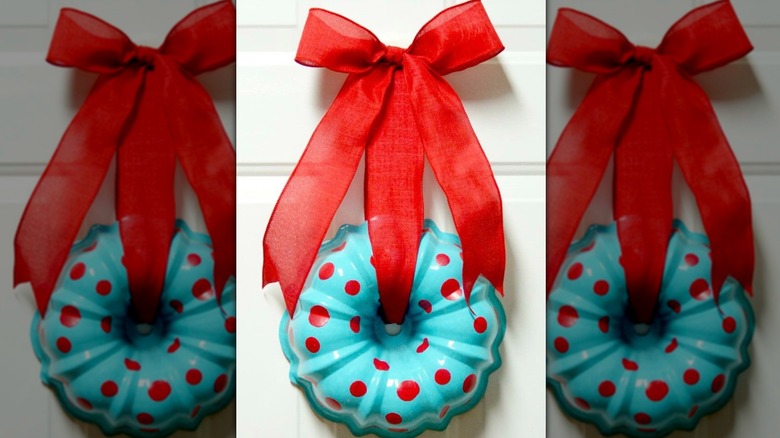 A Christmas-themed farmhouse wall hanging wreath made from an upcycled bundt pan