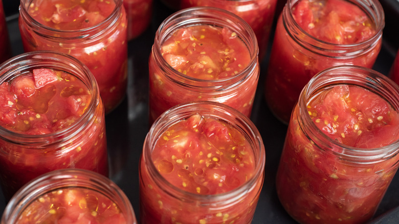 Set of glass jars with salsa in them