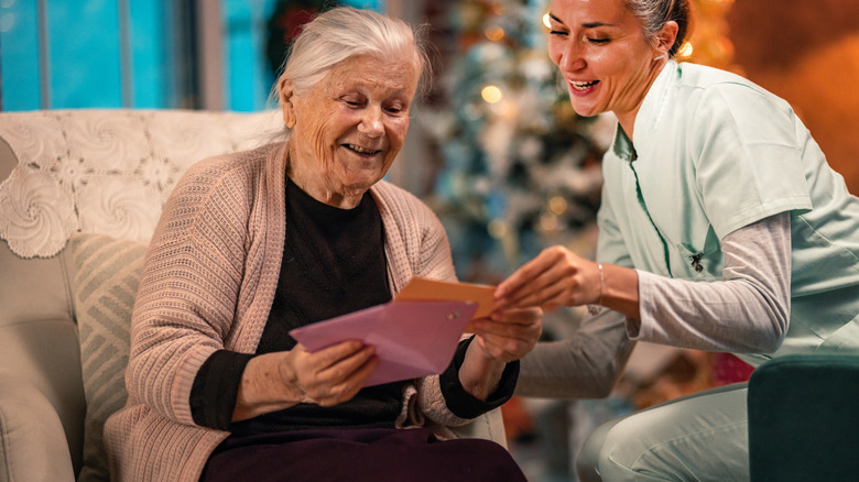 Two women sharing Christmas cards