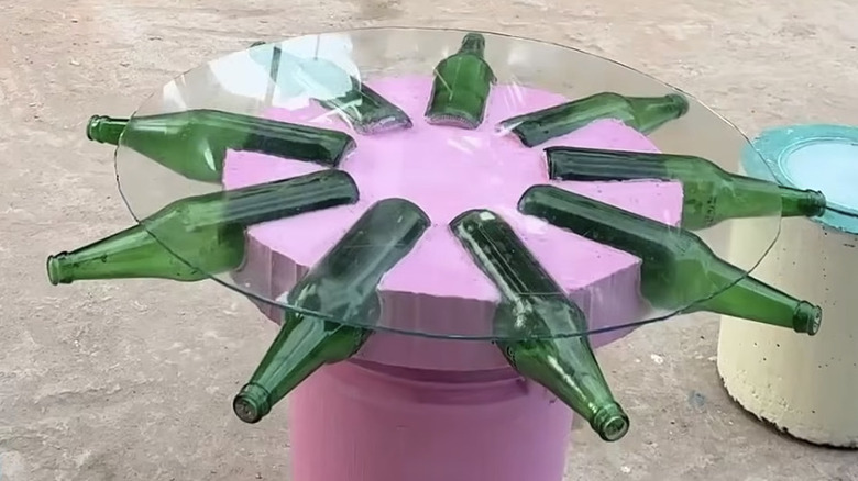 The finished table made from concrete and beer bottles