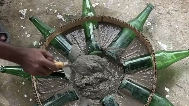 Using concrete and old beer bottles to make a tabletop