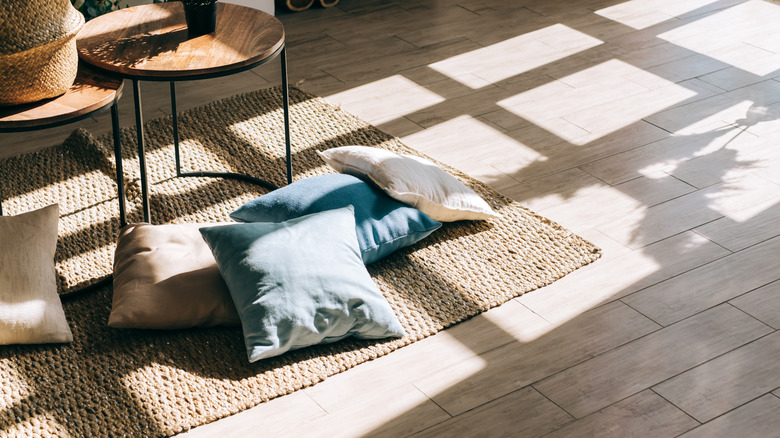 blue and white pillows on floor