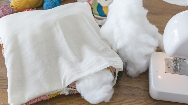 throw pillow being stuffed