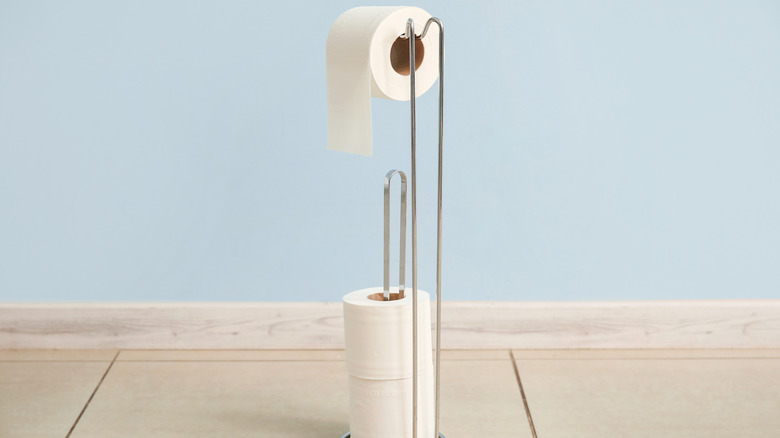 Metal toilet paper holder stand
