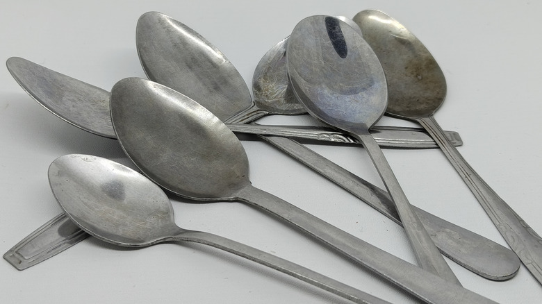 Old spoons stacked against each other