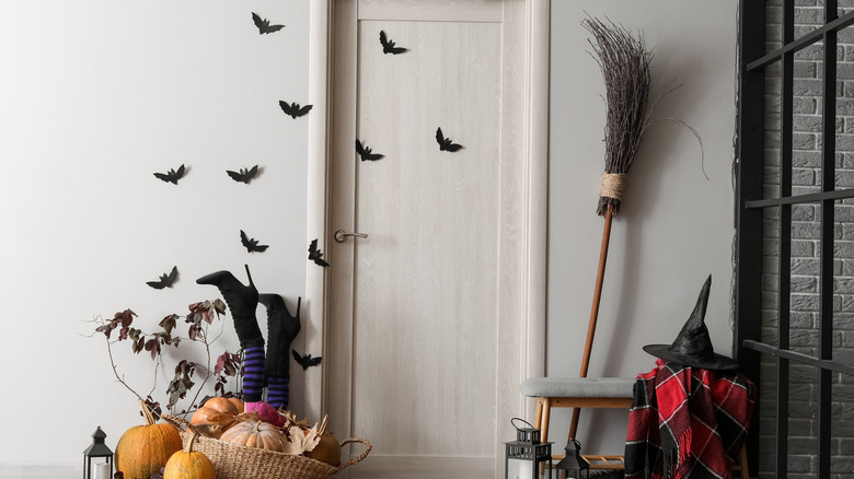 Interior door decorated for Halloween on both sides.