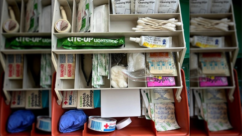 A open box with first aid supplies inside.