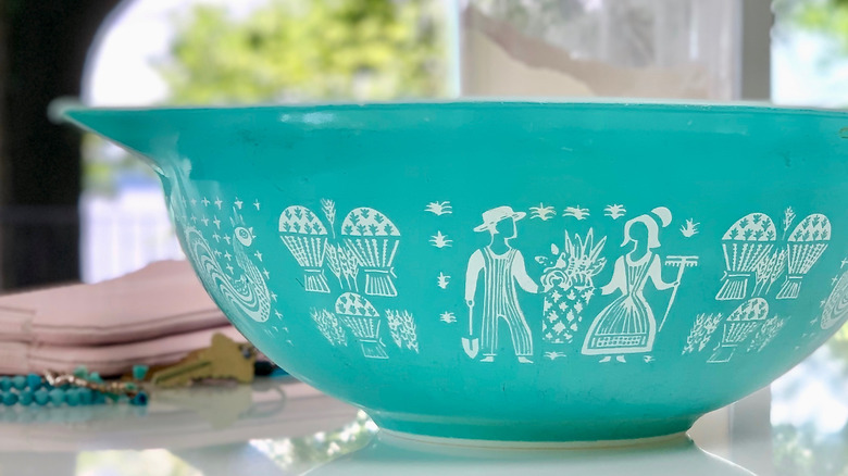 Vintage blue Pyrex bowl with farming pattern