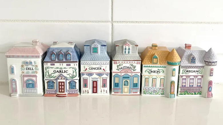 Several spices from Lenox spice village set on a white countertop