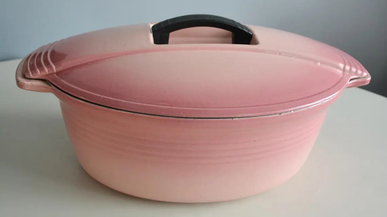 Pink 1980s vintage Le Creuset Large casserole and lid set on white surface