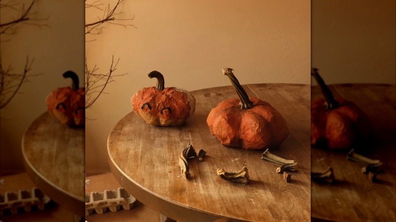 DIY paper-mache pumpkin on a wood table