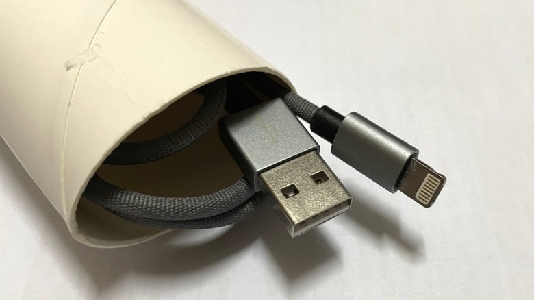 USB to lightning charging cable stored in toilet paper tube