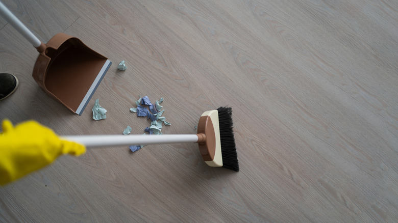 Looking down at broom handle