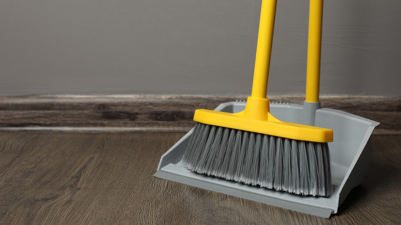 Close-up of a broom and dustpan