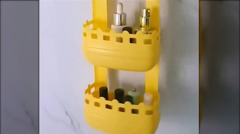 Part of a hanging storage unit made from three plastic detergent bottles