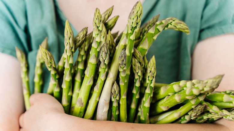 Girl holding asparagus