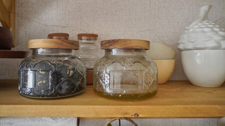 two thrifted decorative glass jars