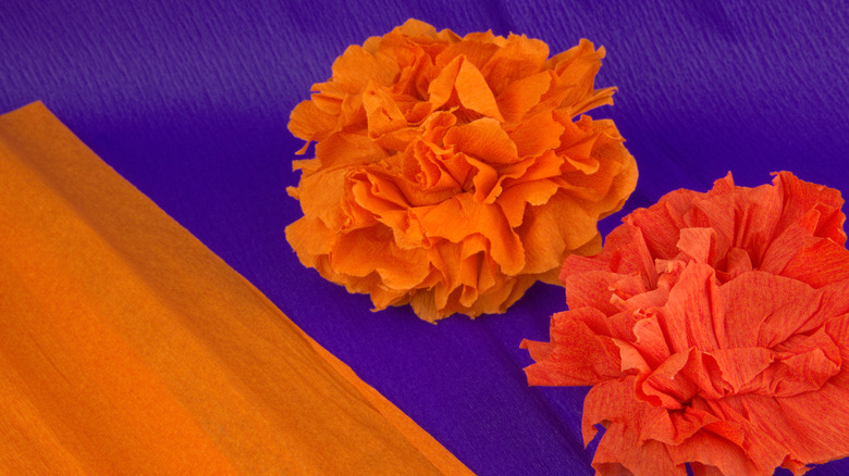 Paper marigolds of different colors made from crepe paper