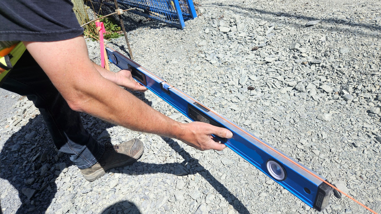 Preparing to lay concrete on slope.