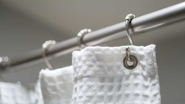 Double Your Shower's Storage Space With This Simple Curtain Rod Hack