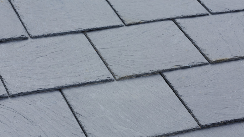 Gray slate tile roofing close-up