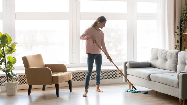 Woman cleaning hardwood floors