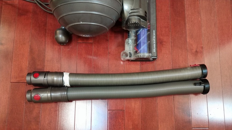 Customer image of offbrand Dyson Animal replacement vacuum hose on hardwood