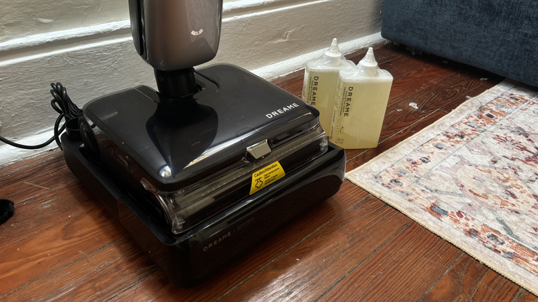 Dreme Aero Ultra Steam on its dock on a wood floor