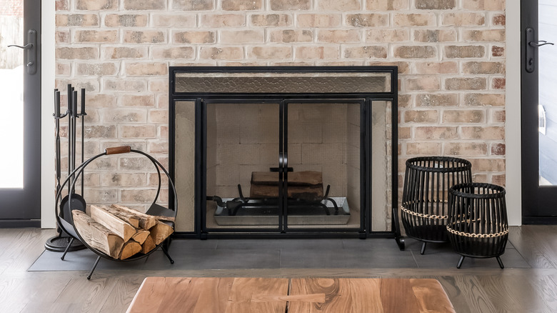 A fireplace surrounded by bricks.