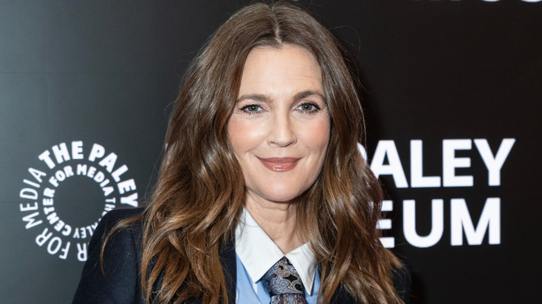 Drew Barrymore smiling at a red carpet event