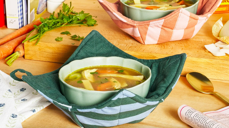 Bowl of soup on a pot holder