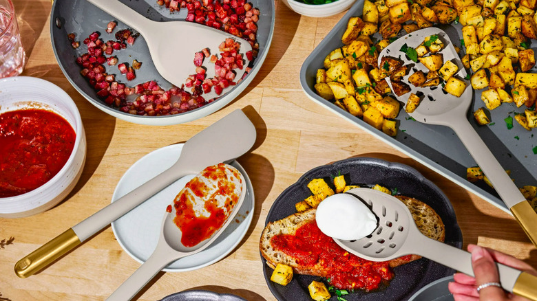 Spoons and plates with food.