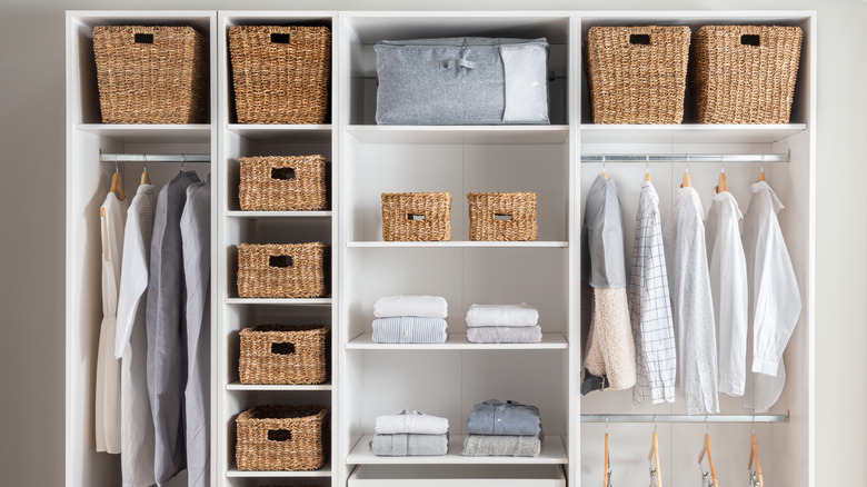 A large closet organized with woven baskets.