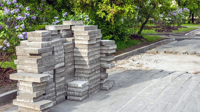 Solid poured concrete driveway slabs ready to be laid on driveway