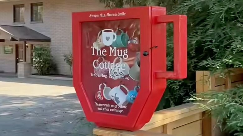 a free mug exchange library with mugs hanging on hooks